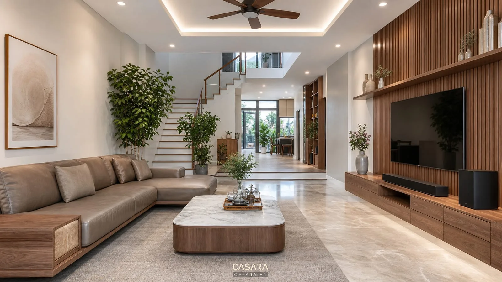 Thi công nội thất phòng khách đẹp với sofa chữ L và kệ tivi gỗ nhiều ngăn