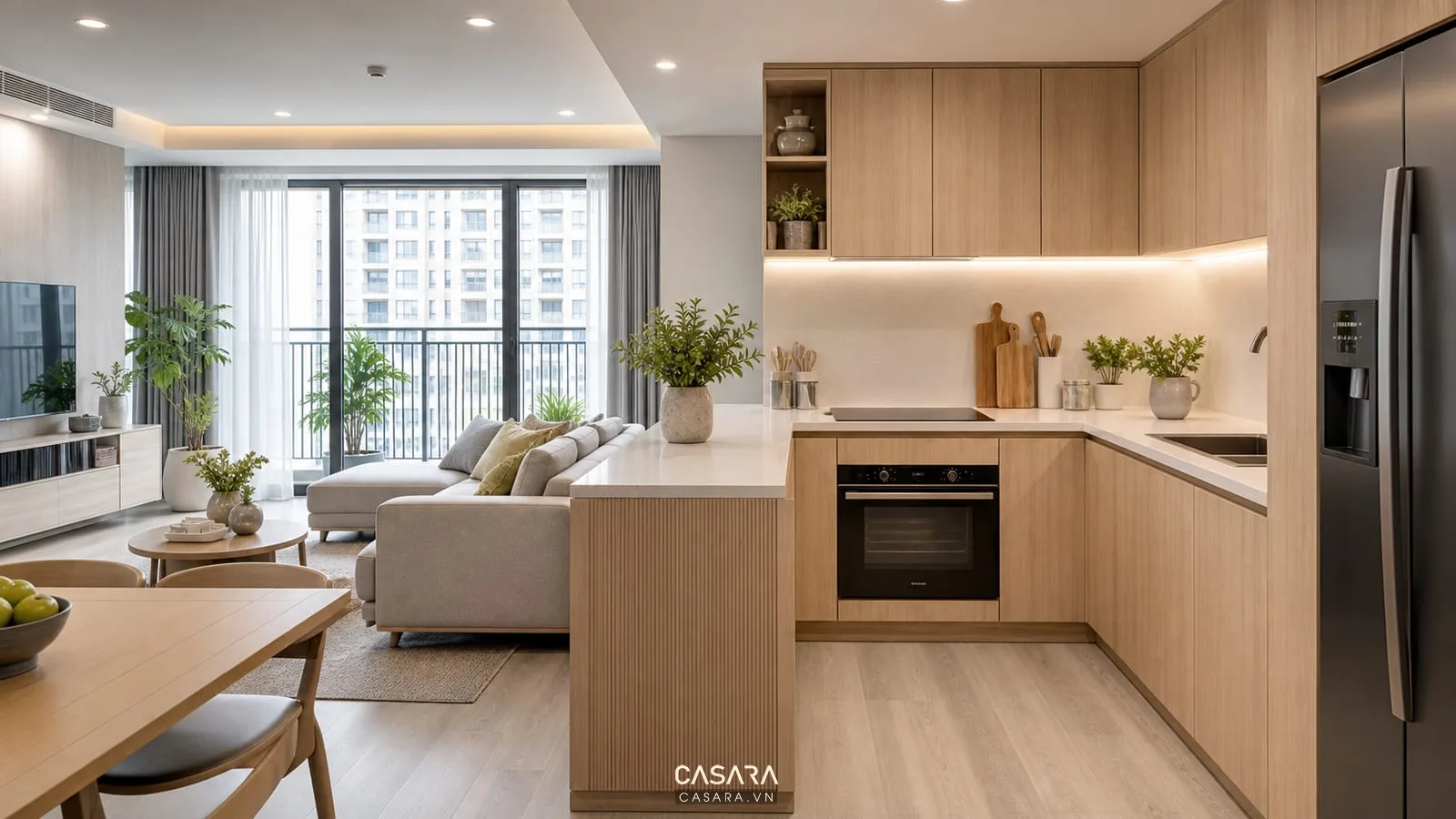 Thiết kế bếp chung cư hiện đại với tủ bếp chữ L đảo bếp nhỏ bàn ăn và phòng khách mở