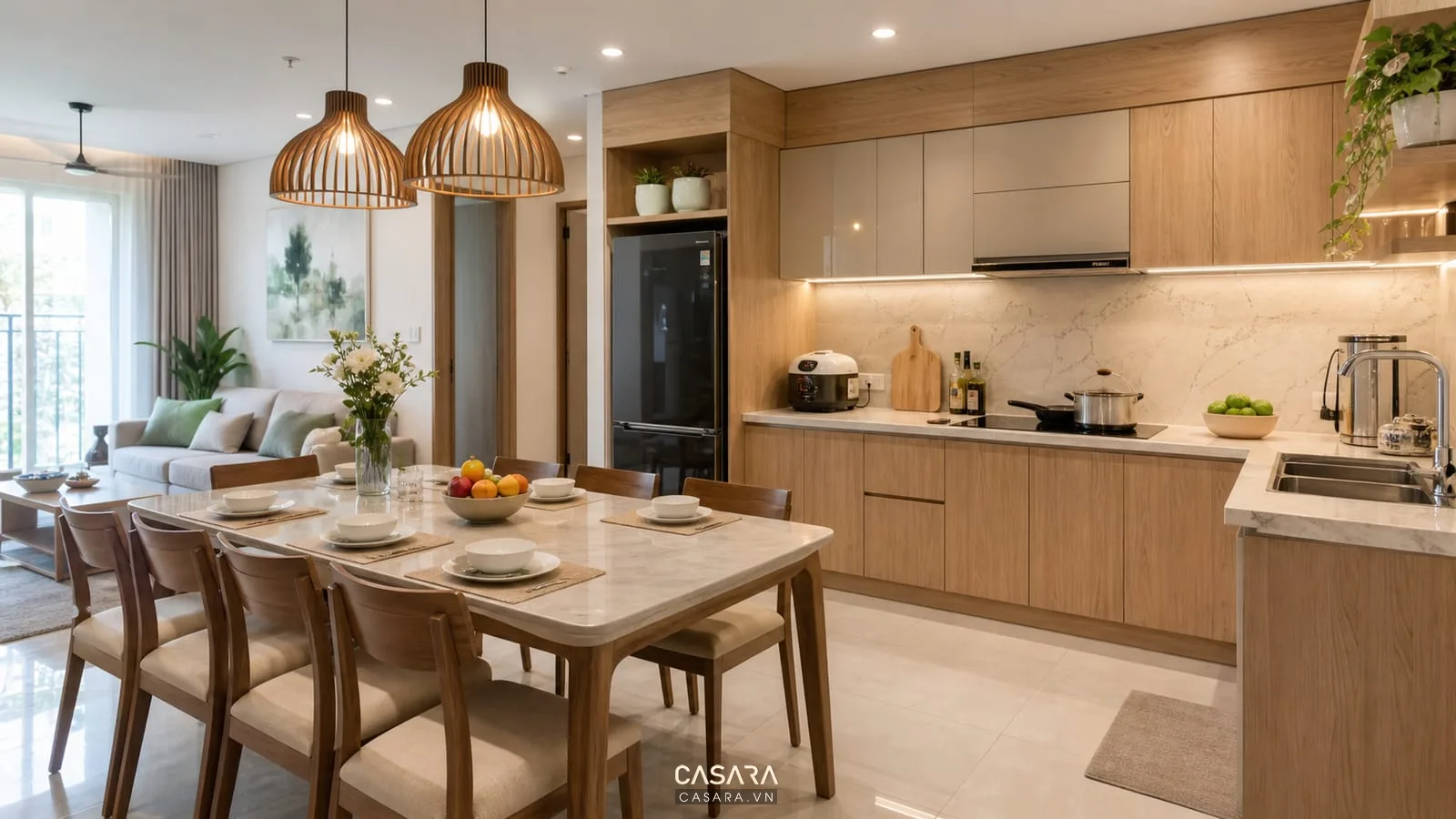 Bếp chung cư trong thiết kế căn hộ 100m2 3 phòng ngủ với tủ bếp gỗ sáng mặt đá và bàn ăn sáu ghế