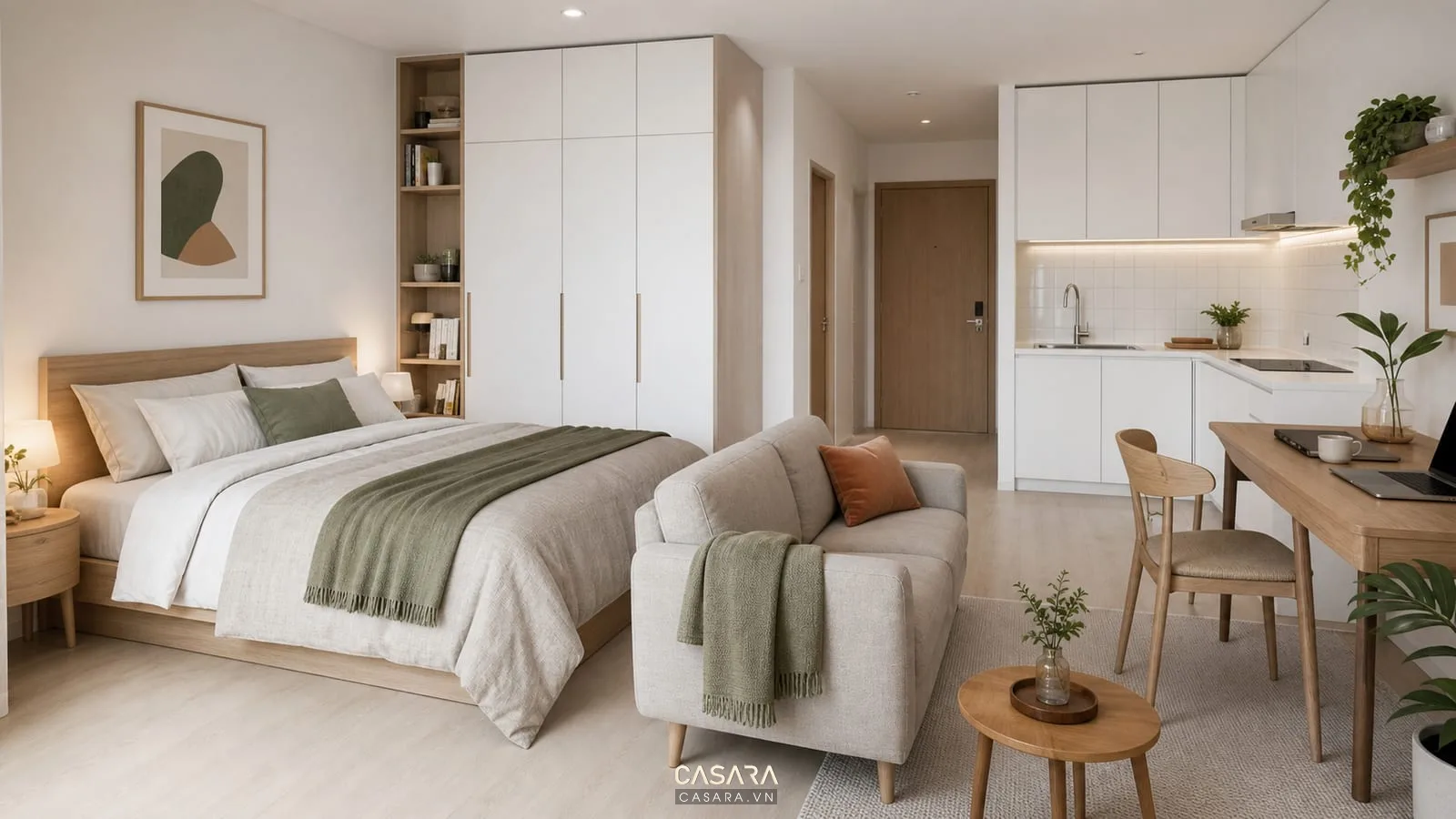 căn hộ studio 25m2 có giường sát tường sofa nhỏ bàn ăn kiêm bàn làm việc bếp thẳng màu trắng và tủ lưu trữ cao