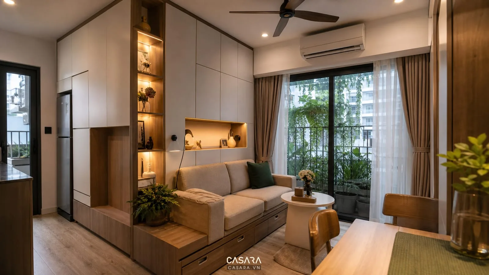 căn hộ 50m2 2 phòng ngủ với phòng khách nhỏ sofa văng và bàn ăn tròn