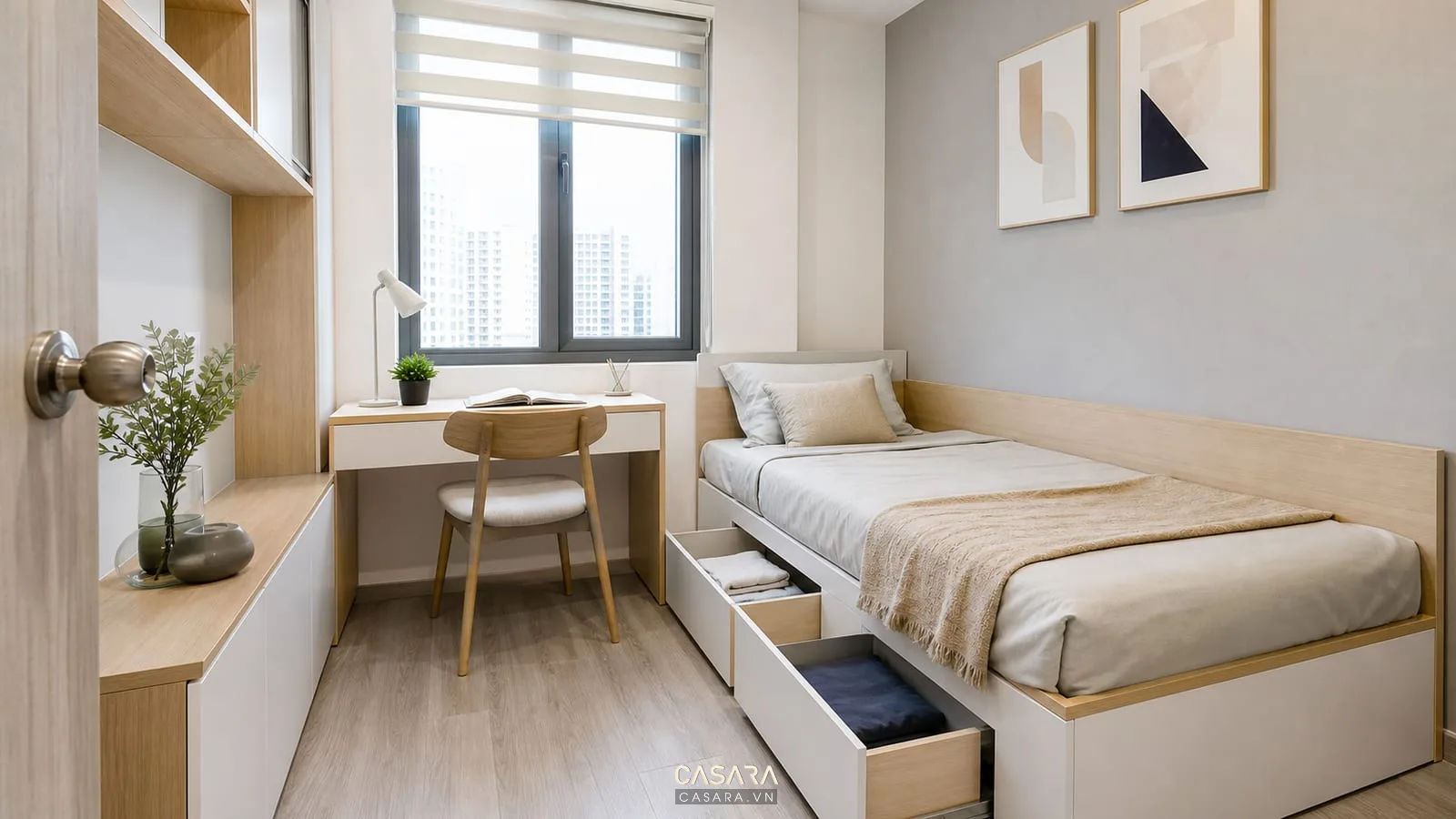 Phòng ngủ phụ căn hộ 40m2 có giường đơn hộc kéo và bàn làm việc