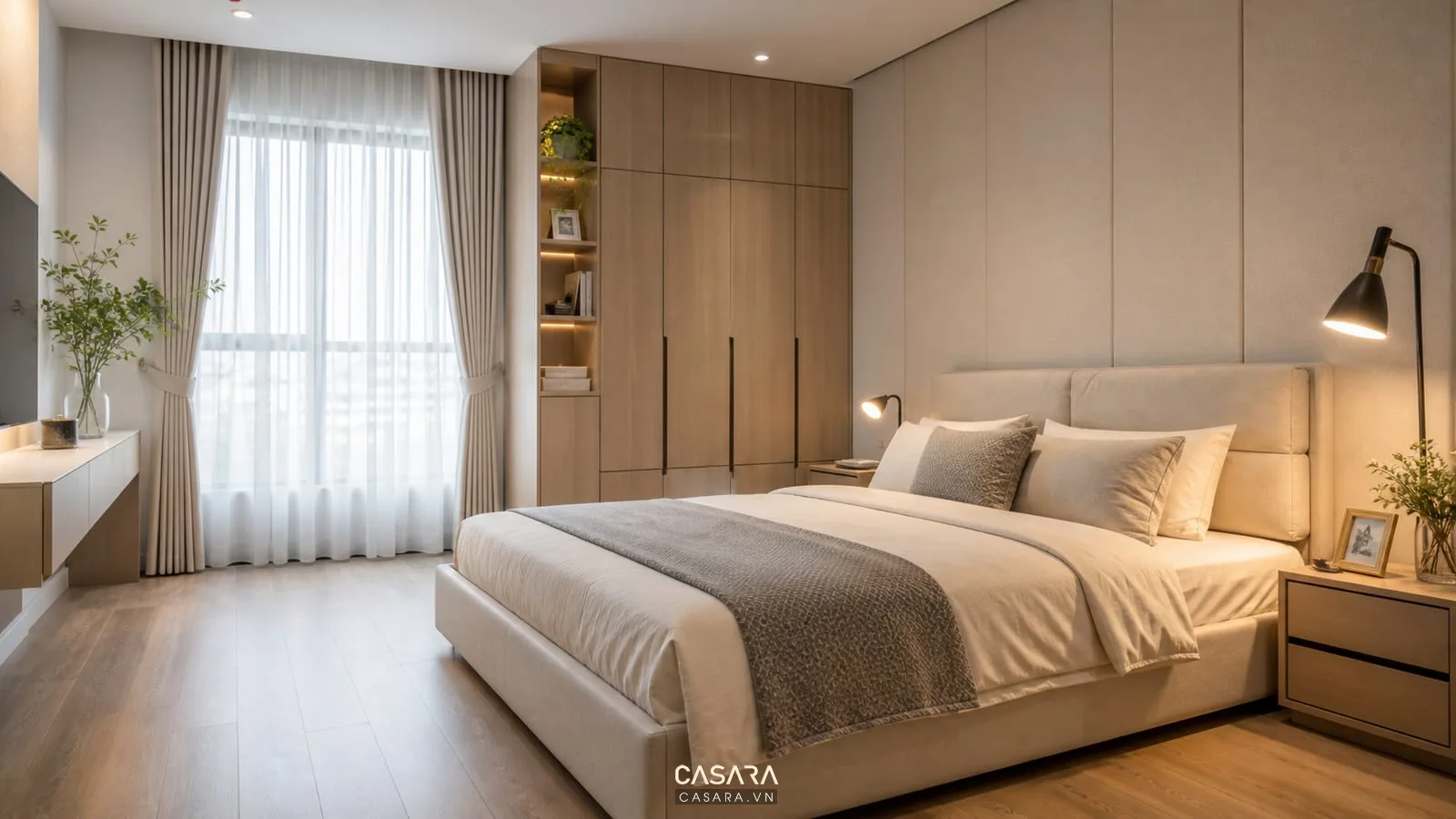 Phòng ngủ chung cư 70m2 với giường bọc nệm tủ áo kịch trần và đèn đọc sách