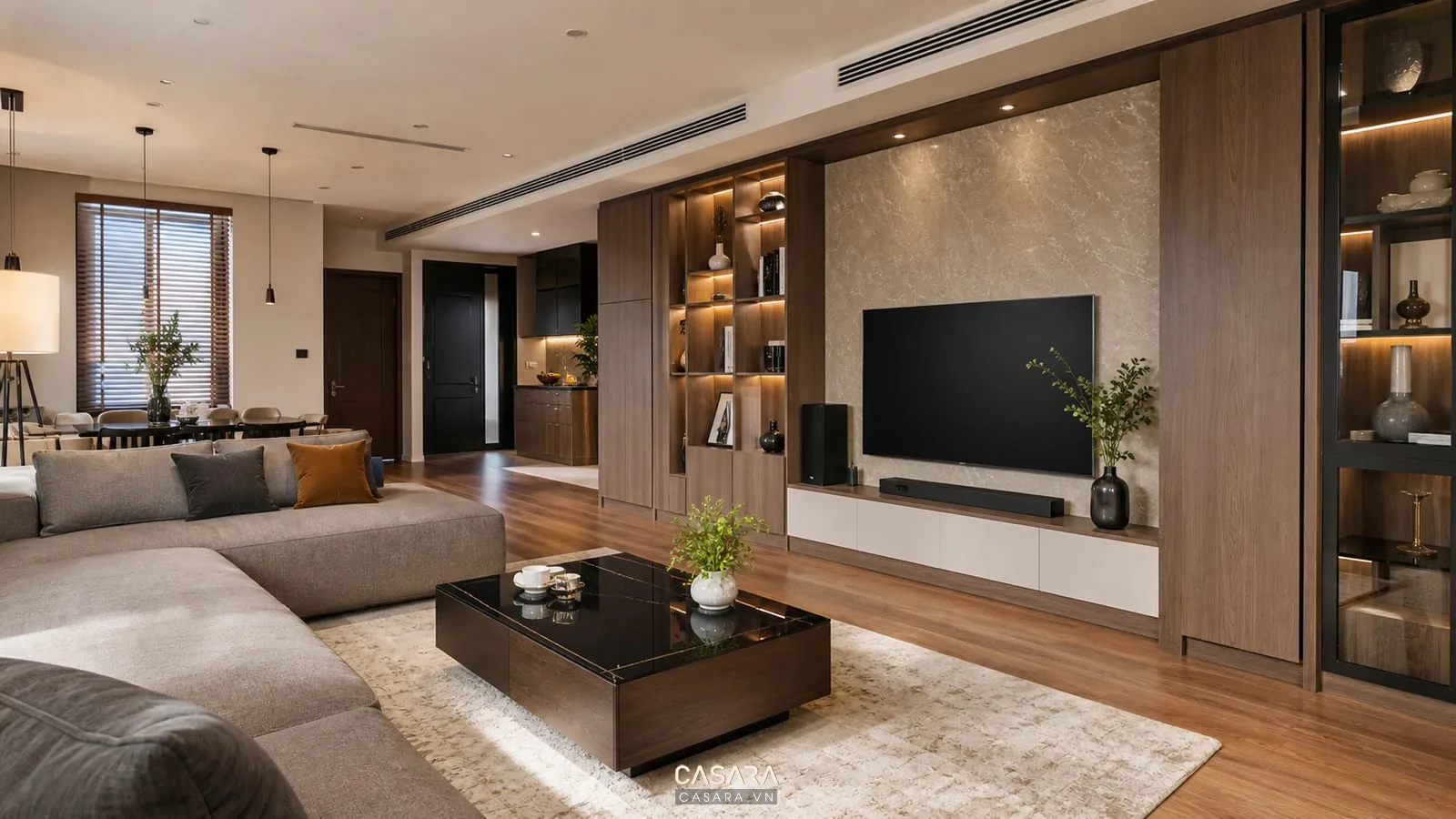 Thiết kế phòng khách đẹp với sofa chữ L bàn trà tròn và kệ tivi gỗ
