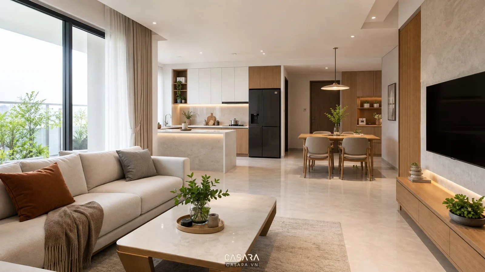 Phòng khách chung cư hiện đại liên thông bếp ăn có sofa chữ L và thảm phân vùng