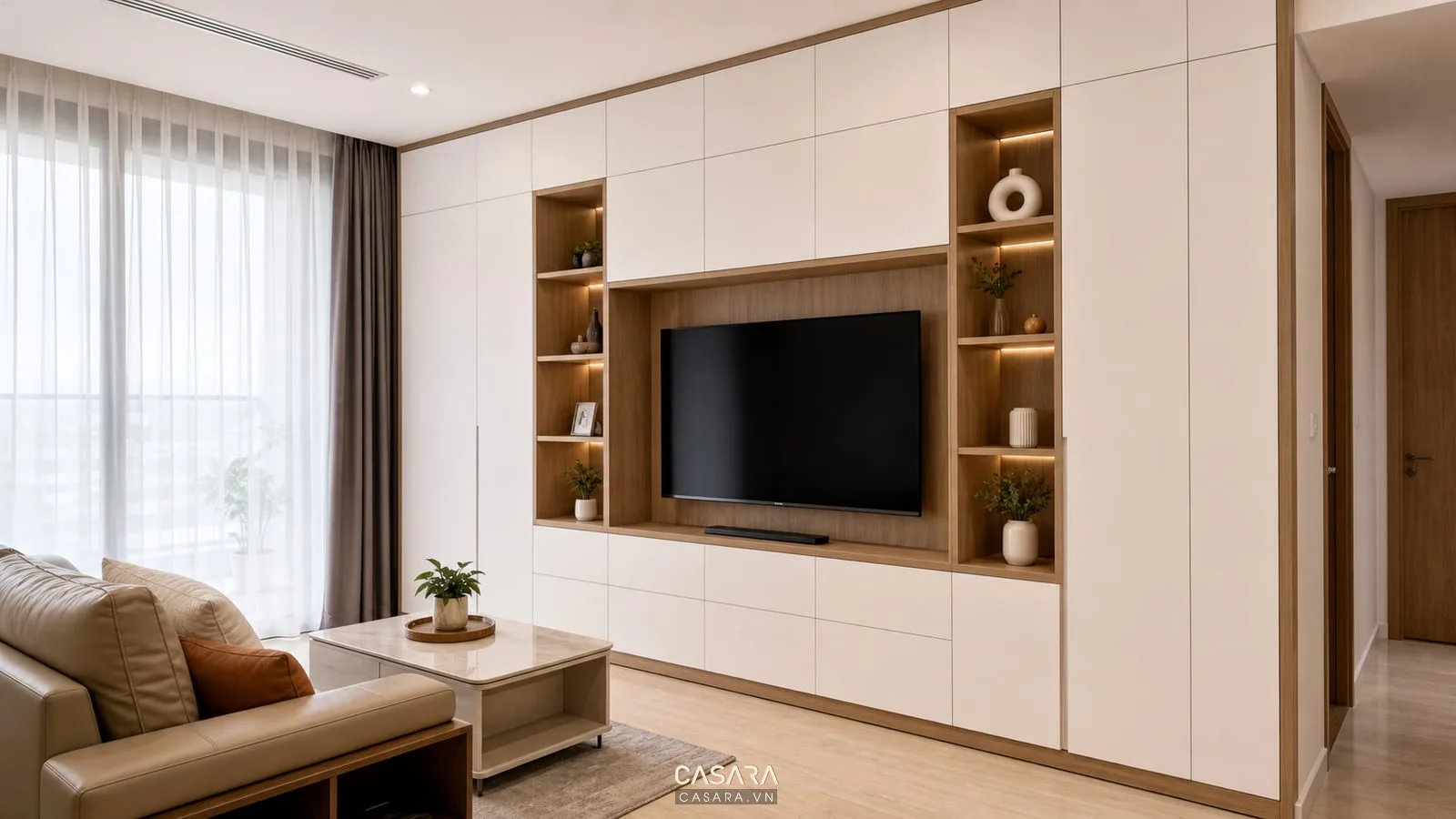 tủ phòng khách chung cư kịch trần màu trắng gỗ với kệ tivi liền mạch